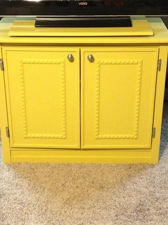 Yellow t.v. cabinet