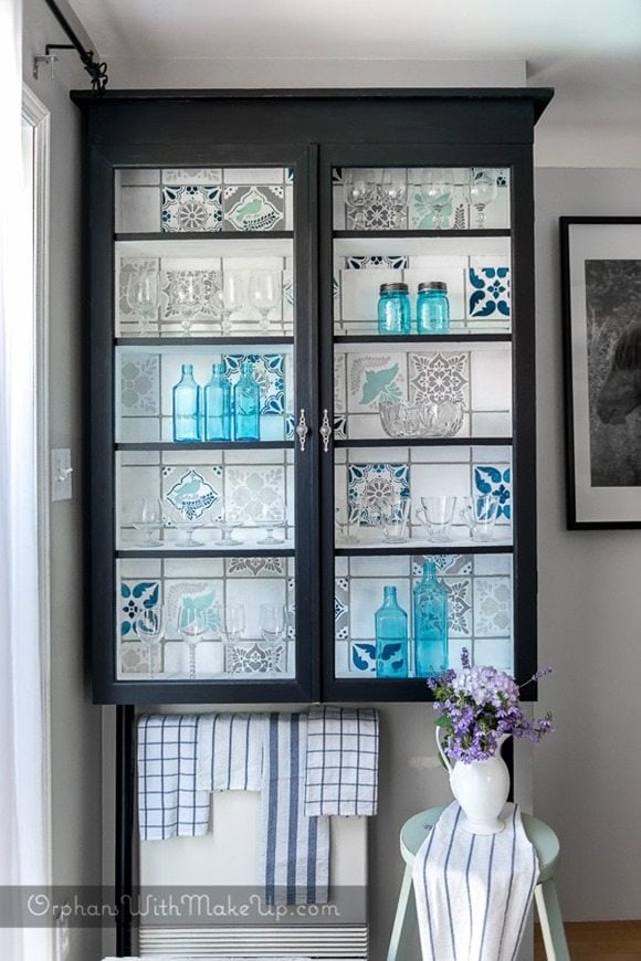 glass cabinet makeover with stencils featured at Talk of the Town at www.knickoftime.net