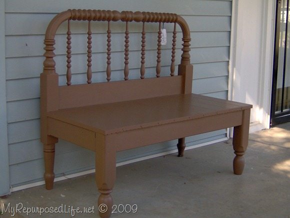 Brown twin spool bed repurposed into a bench