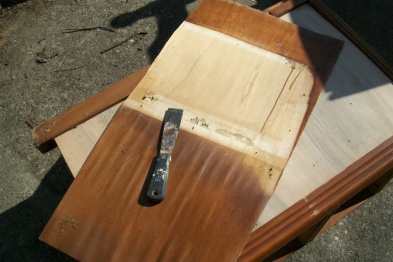 removing bad veneer with a putty knife