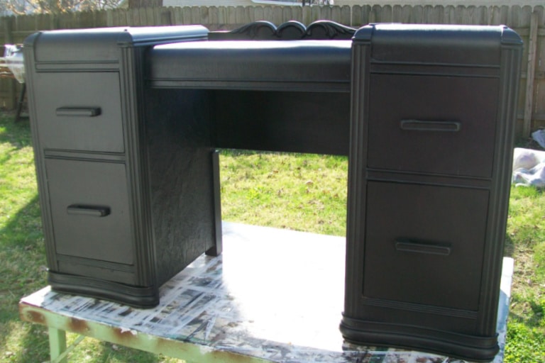 black desk made from a waterfall vanity