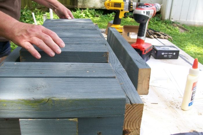add 2x4 slats to easy reclaimed lumber bench