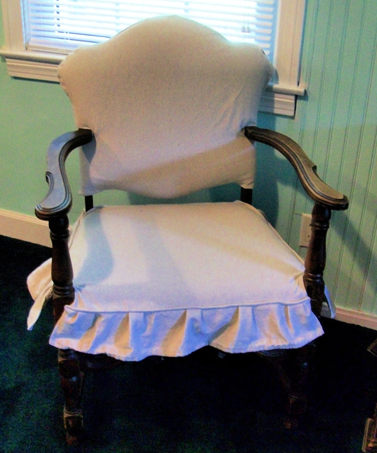 antique chair with a drop cloth cover