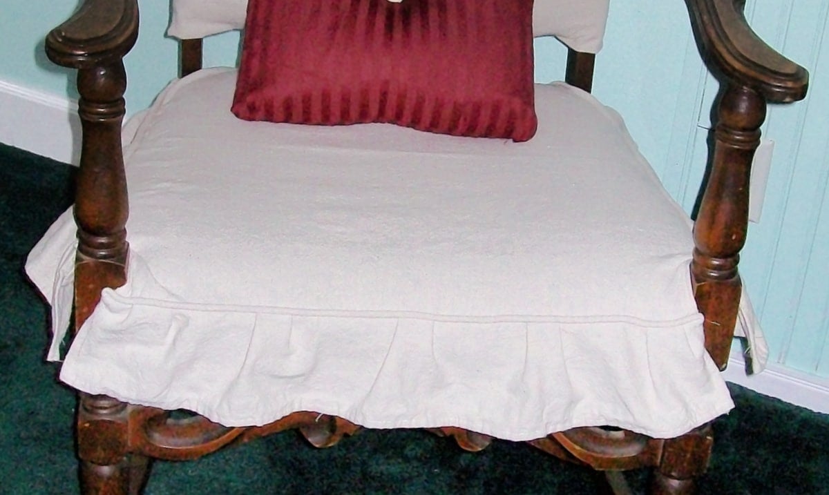 closeup image of the diy ruffled slipcover for an antique chair