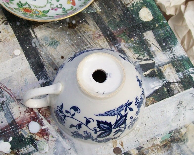 teacup with a hole drilled in the bottom