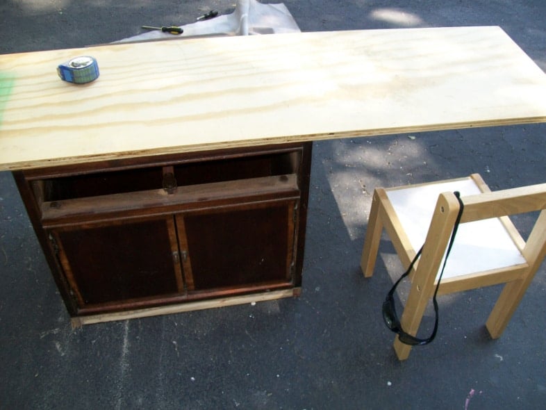 old nightstand with a piece of pywood to be a desk with a wooden chair