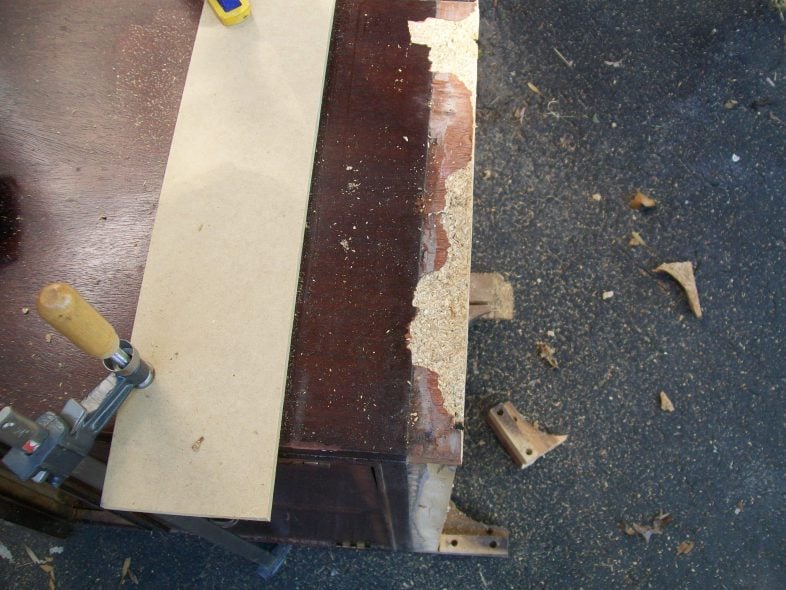 prepare to cut lower portion of nightstand