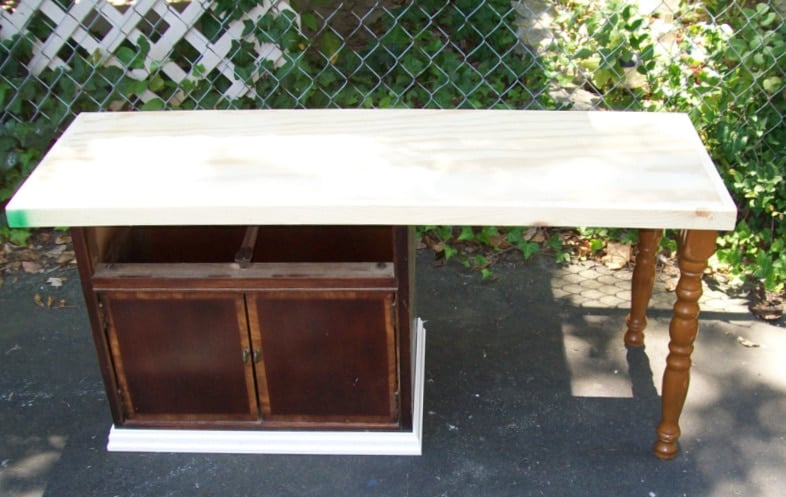 reclaimed materials come together to transform a nightstand into a childs desk