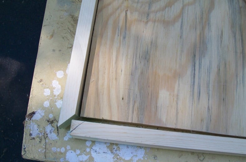 small pieces of trim to make a frame for the plywood desk top