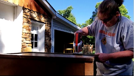 using a jigsaw to cut a desk