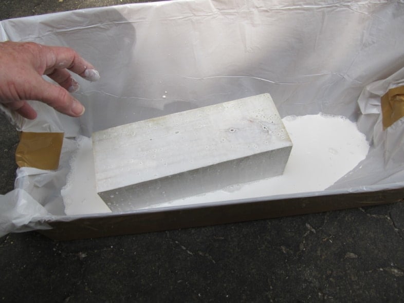 dip 4x4 wooden post into paint