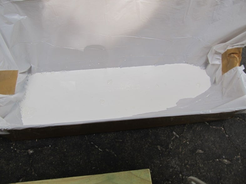 pour paint into cardboard box