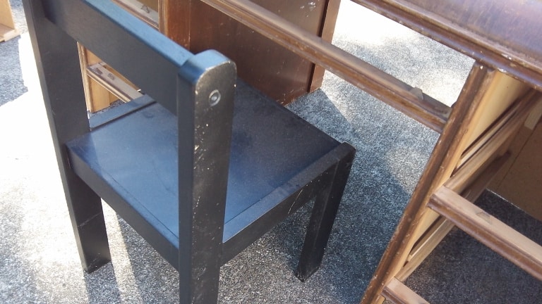 small chair sitting at small unfinished desk