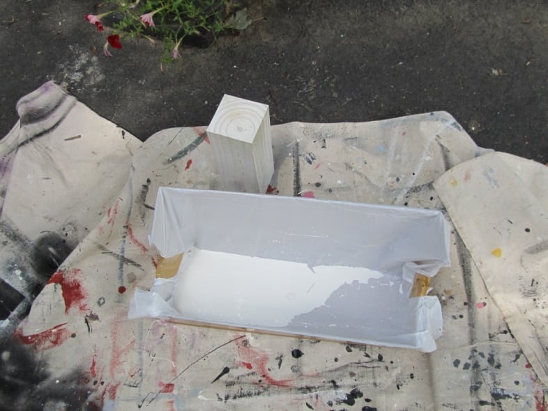 white 4 x 4 wooden post paint drying