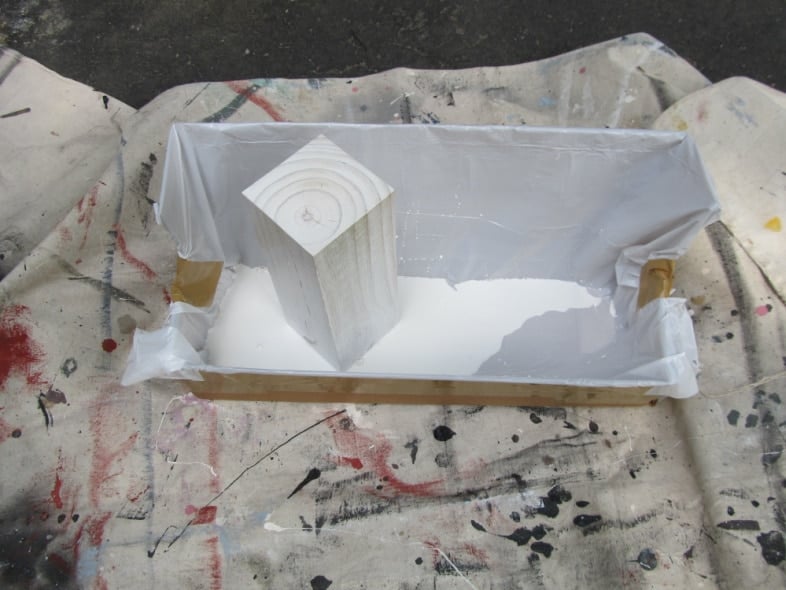 white 4 x 4 wooden post upright in cardboard box