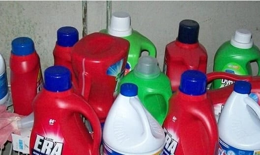 a dozen laundry jugs