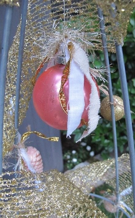 pink ball ornament tomato cage tree