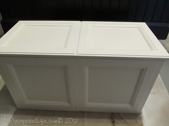 white toy box made from cabinet doors