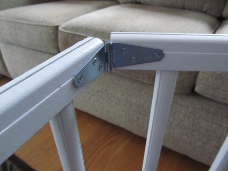 small hinge holding two side rails together