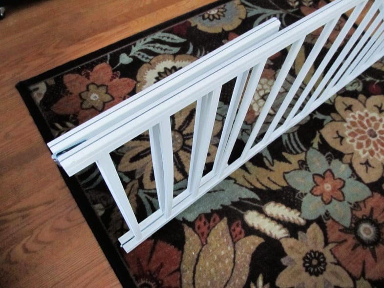 adjustable dog gate folds for storage