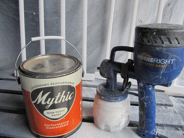 gallon of paint and a paint sprayer