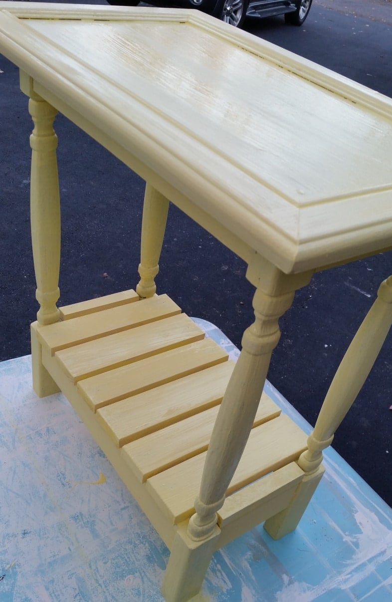 yellow table made with a cabinet door and spindles