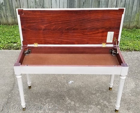 white piano bench with lid open white piano bench with lid open