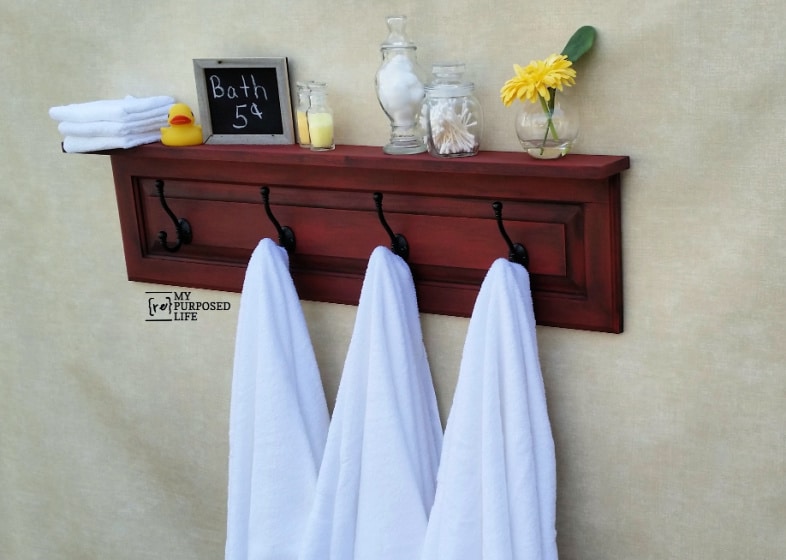 DIY coat rack shelf made from a cabinet door