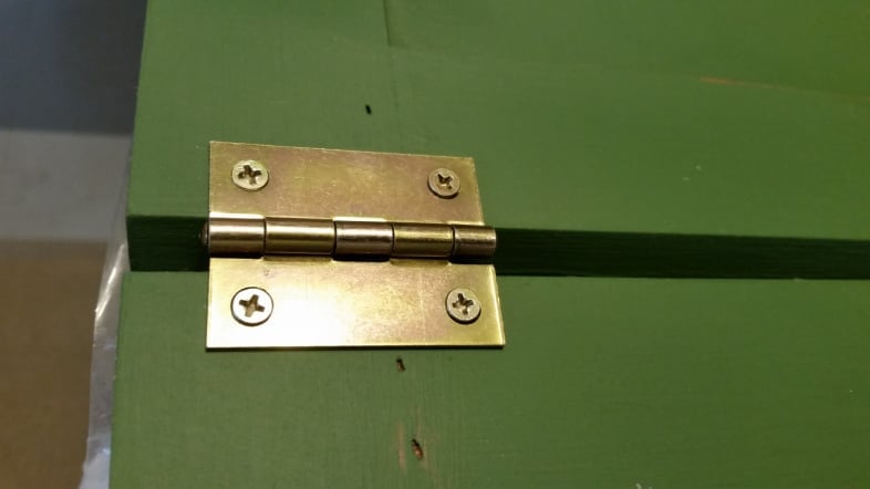 brass hinge on chalkboard easel