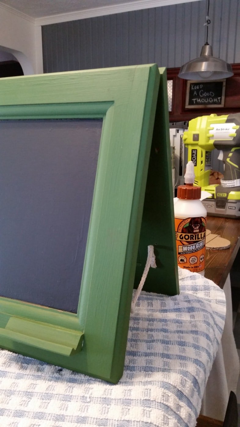 side view of chalkboard easel with rope