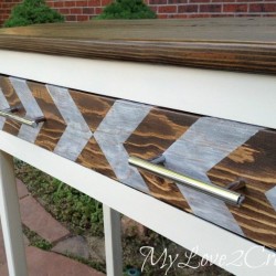 Close up of entry table arrow painted drawer