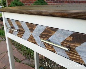 Close up of entry table arrow painted drawer