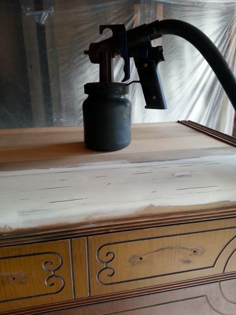 paint sprayer sitting on top of dresser ready to paint