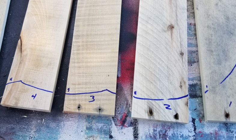 trace pumpkin cut out onto pallet boards and number them