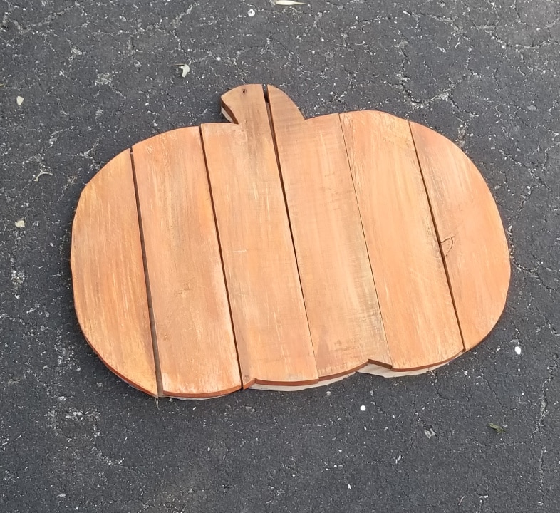 orange wooden pallet pieces laying on paper pattern