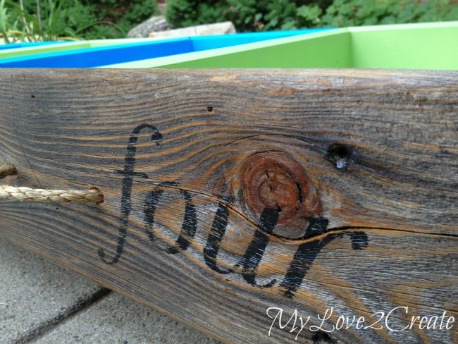 Close up of old fence wood front to under the bed storage