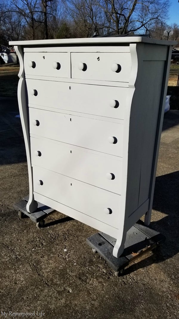 move antique chest of drawers on furniture dollies to dry in the sun move antique chest of drawers on furniture dollies to dry in the sun