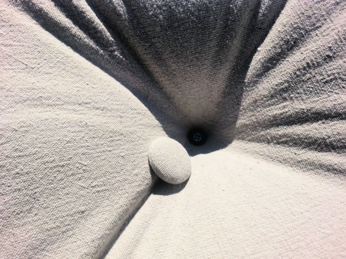 how to DIY button tufting with staples and screws