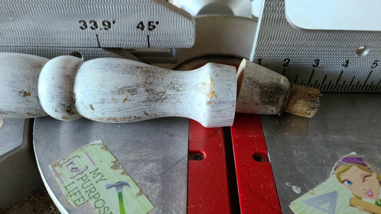 carefully cut chair spindle on compound miter saw