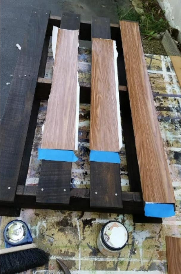 contact paper stencils laying on a dark colored pallet