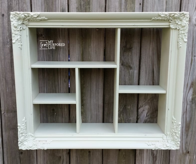 green shadow box with cubbies