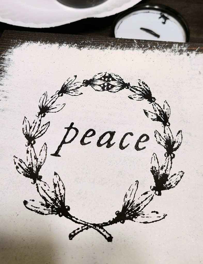 scrap wood block with wreath and the word peace