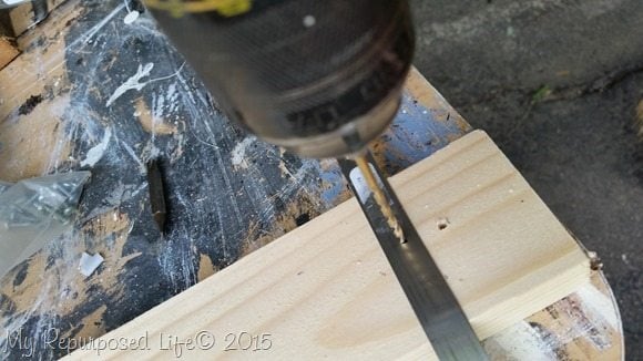drill-hole-hose-clamp-scrap-wood