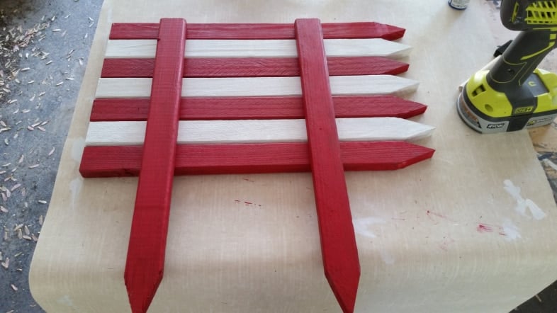 the back of a garden stake flag pointing to the right