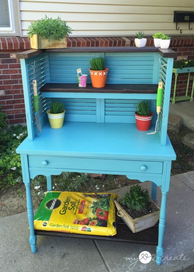 Repurposed shudders and desk into potting bench
