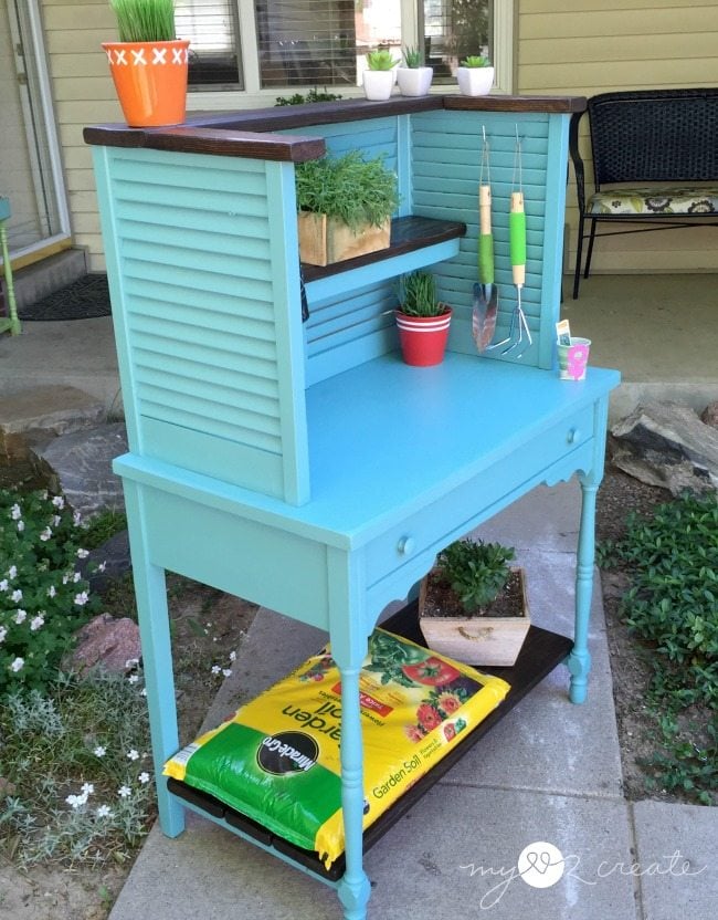 side shot of potting bench repurposed from shudders and desk