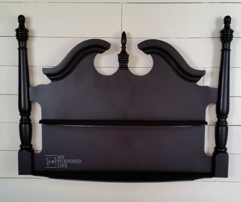 black shelf made from a twin headboard
