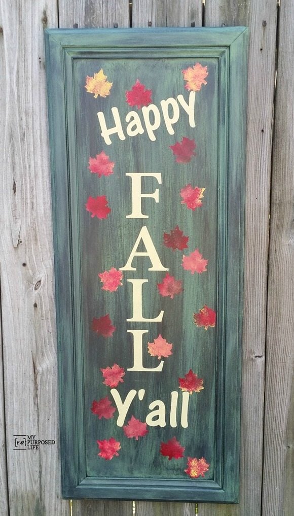 How to make an easy Happy Fall Yall sign out of a repurposed cabinet door. Paint and stenciling tips. Easy afternoon project for your fall porch or entryway. #MyRepurposedLife #repurposed #cabinet #door #sign #fall #decor #porch via @repurposedlife