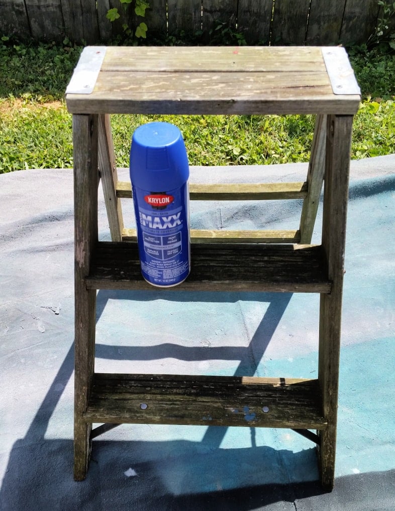 old wooden stepladder ready for blue spraypaint