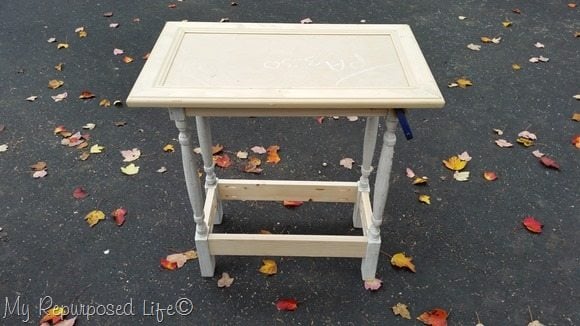 how to make a small table using a cabinet door and some spindles